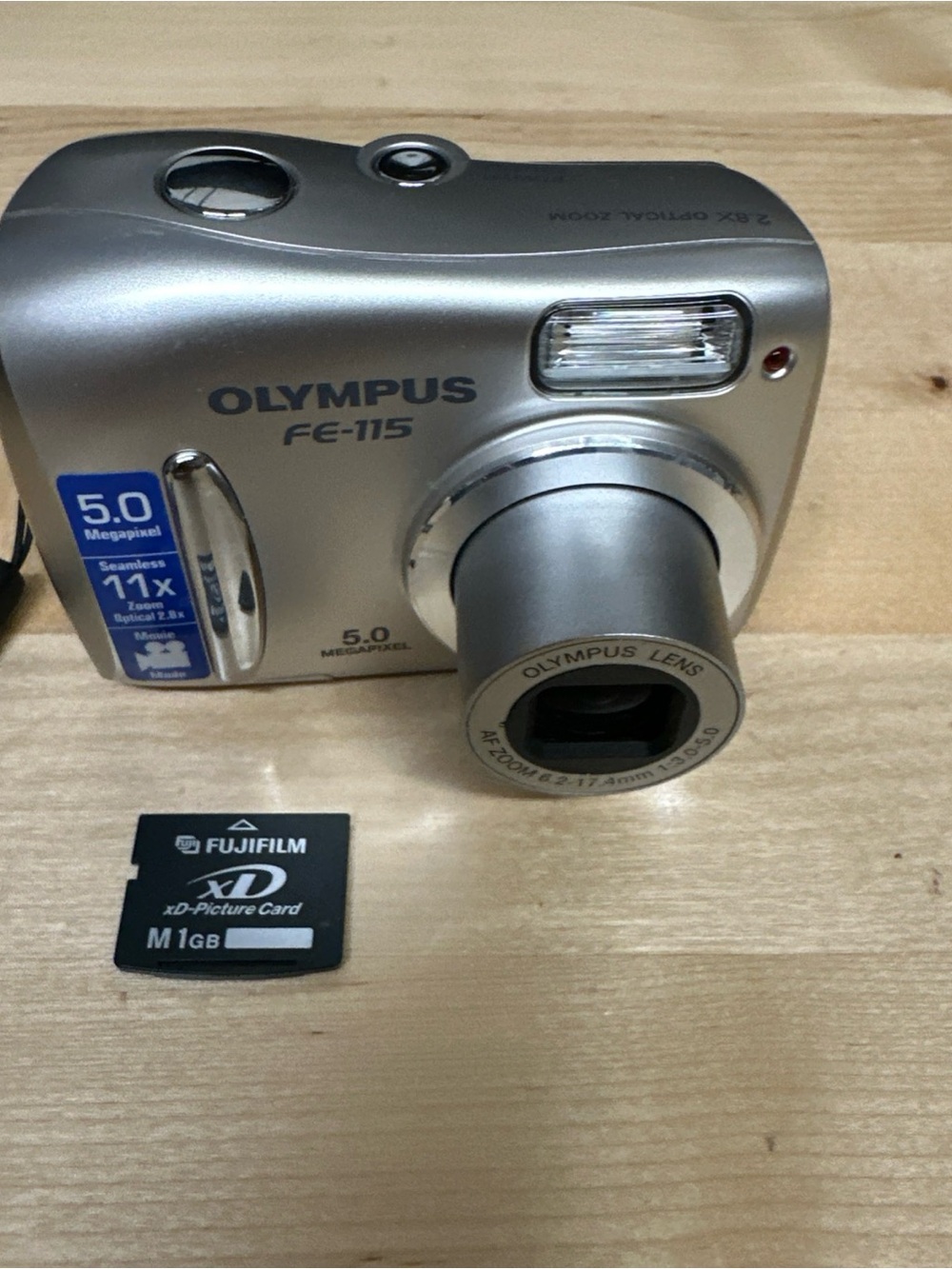 Olympus Silver Compact Digital Camera with Pop-Out Lens pocket camera